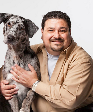Angelo Savarino, licensed insurance agent, with his dog